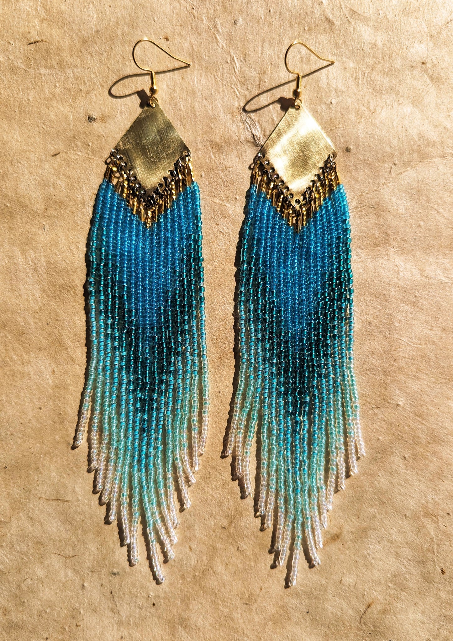 Long ombré blue and seafoam green beaded earrings by Moon & Milk, handmade with brass findings and inspired by Greek naiads and freshwater mysticism