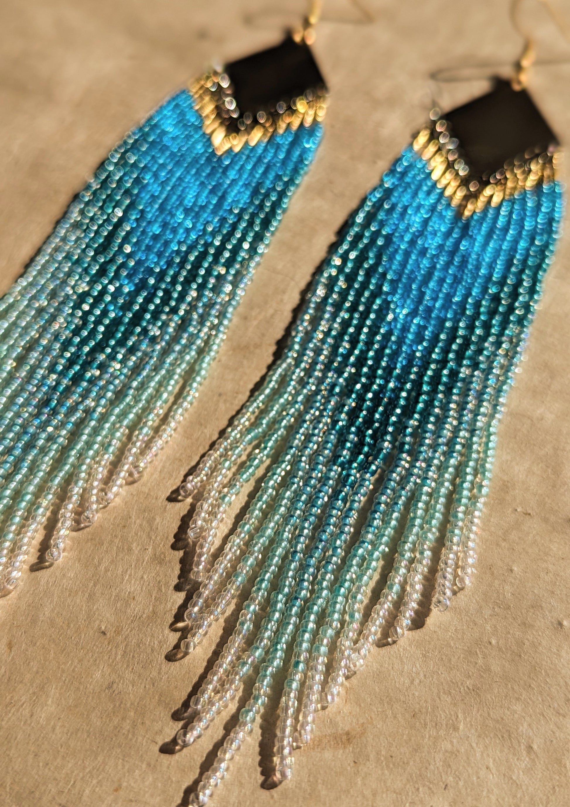 Long ombré blue and seafoam green beaded earrings by Moon & Milk, handmade with brass findings and inspired by Greek naiads and freshwater mysticism