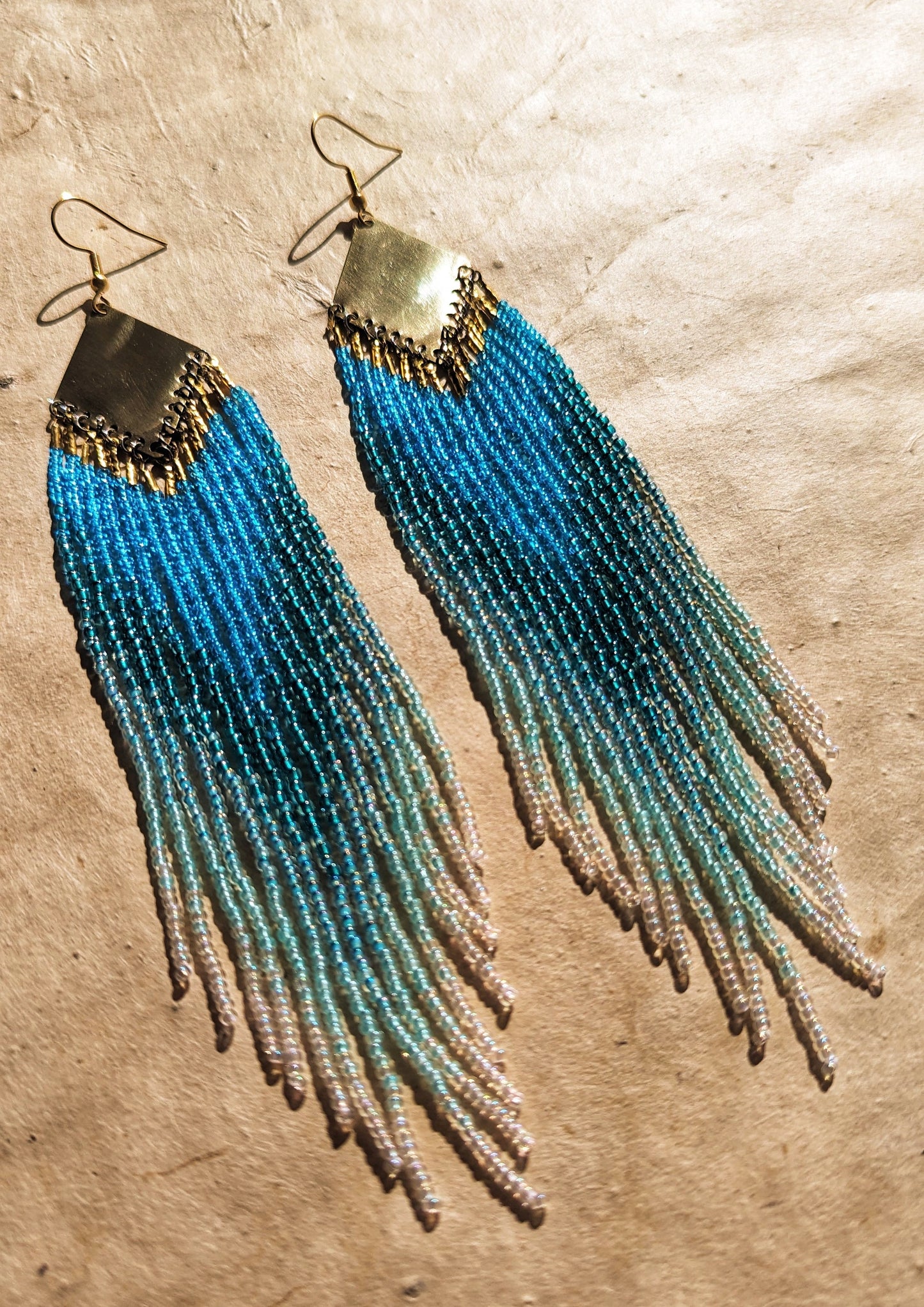 Long ombré blue and seafoam green beaded earrings by Moon & Milk, handmade with brass findings and inspired by Greek naiads and freshwater mysticism