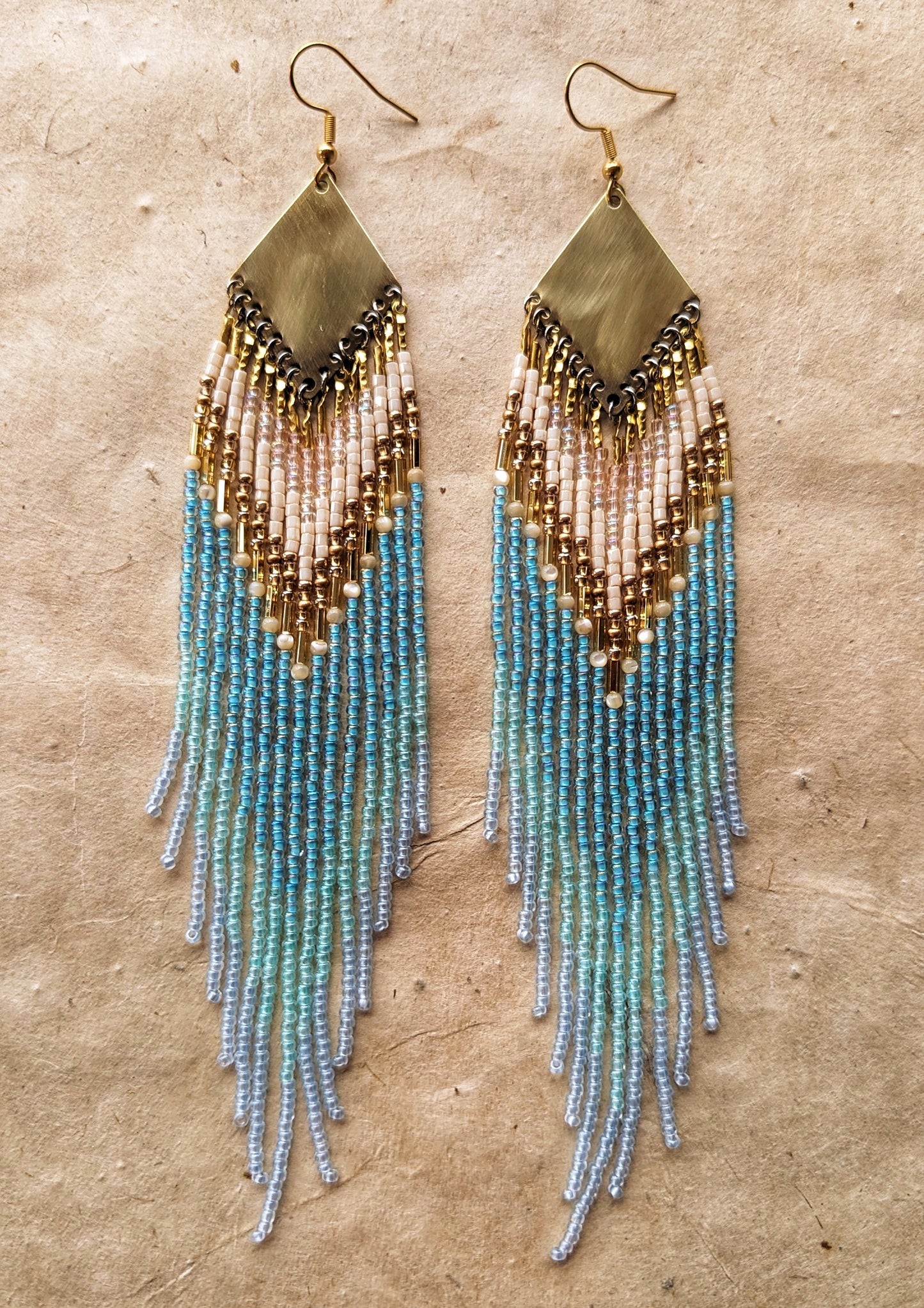 Long blue and seafoam green handcrafted beaded earrings by Moon & Milk with brass findings, inspired by Greek mythology.