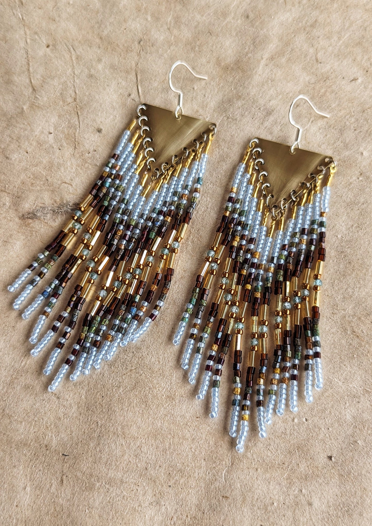 Moon & Milk beaded earrings blend earthy brown and watery blue seed beads with brass findings, handcrafted statement jewelry rooted in nature.