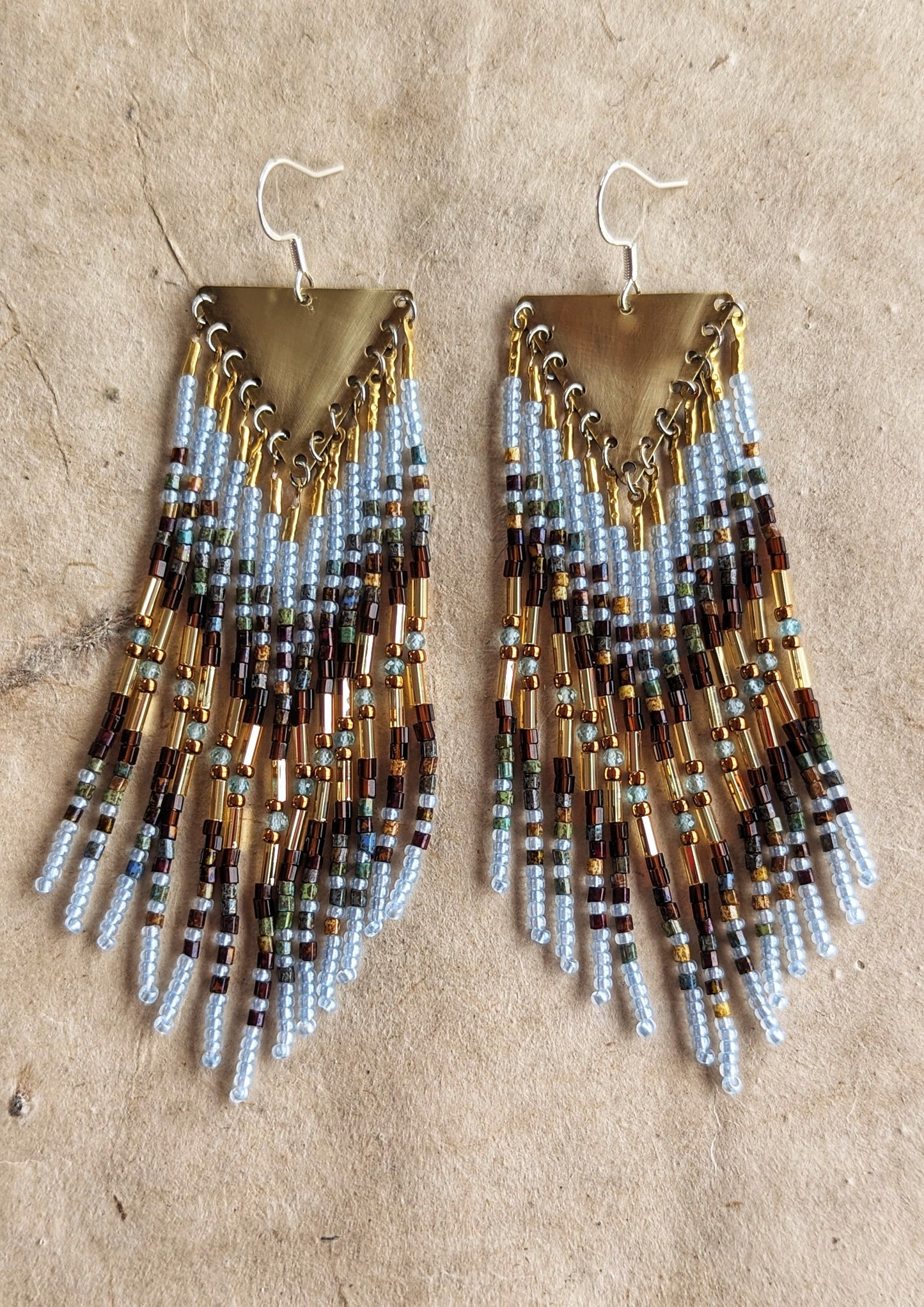 Moon & Milk beaded earrings blend earthy brown and watery blue seed beads with brass findings, handcrafted statement jewelry rooted in nature.