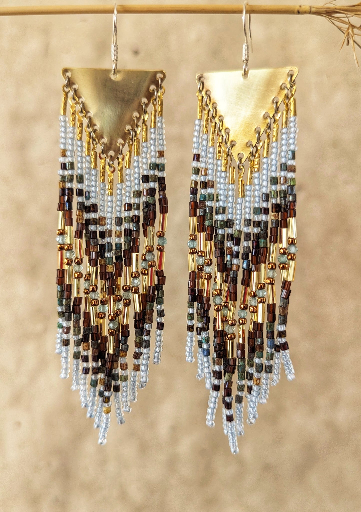 Moon & Milk beaded earrings blend earthy brown and watery blue seed beads with brass findings, handcrafted statement jewelry rooted in nature.
