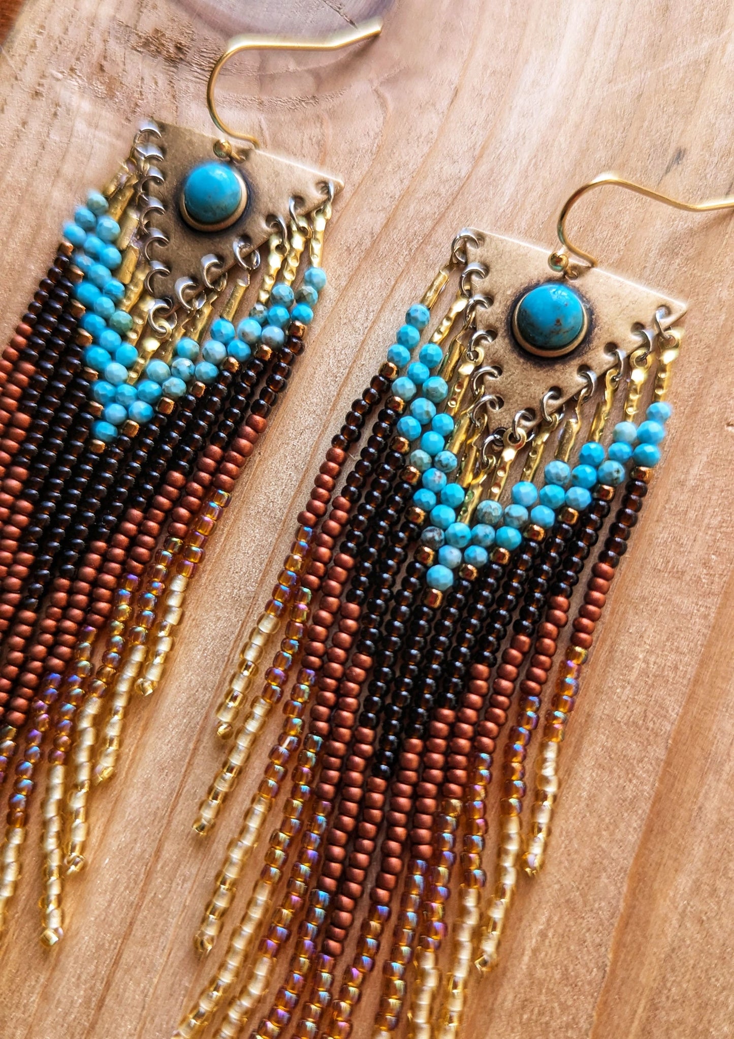 Handcrafted beaded earrings by Moon & Milk with turquoise accents, seed beads, and brass, featuring an artistic, textured design that makes a statement.