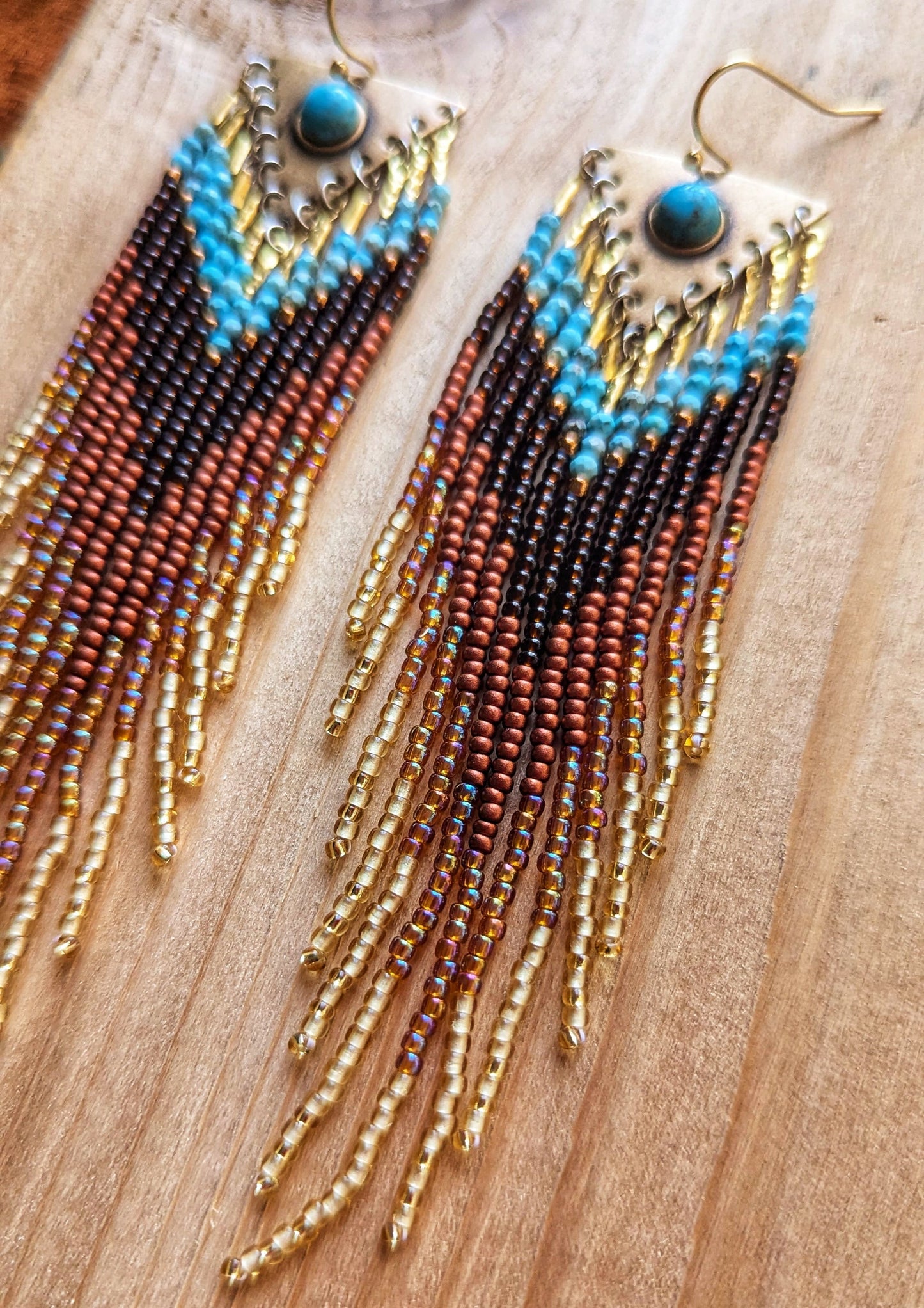 Handcrafted beaded earrings by Moon & Milk with turquoise accents, seed beads, and brass, featuring an artistic, textured design that makes a statement.