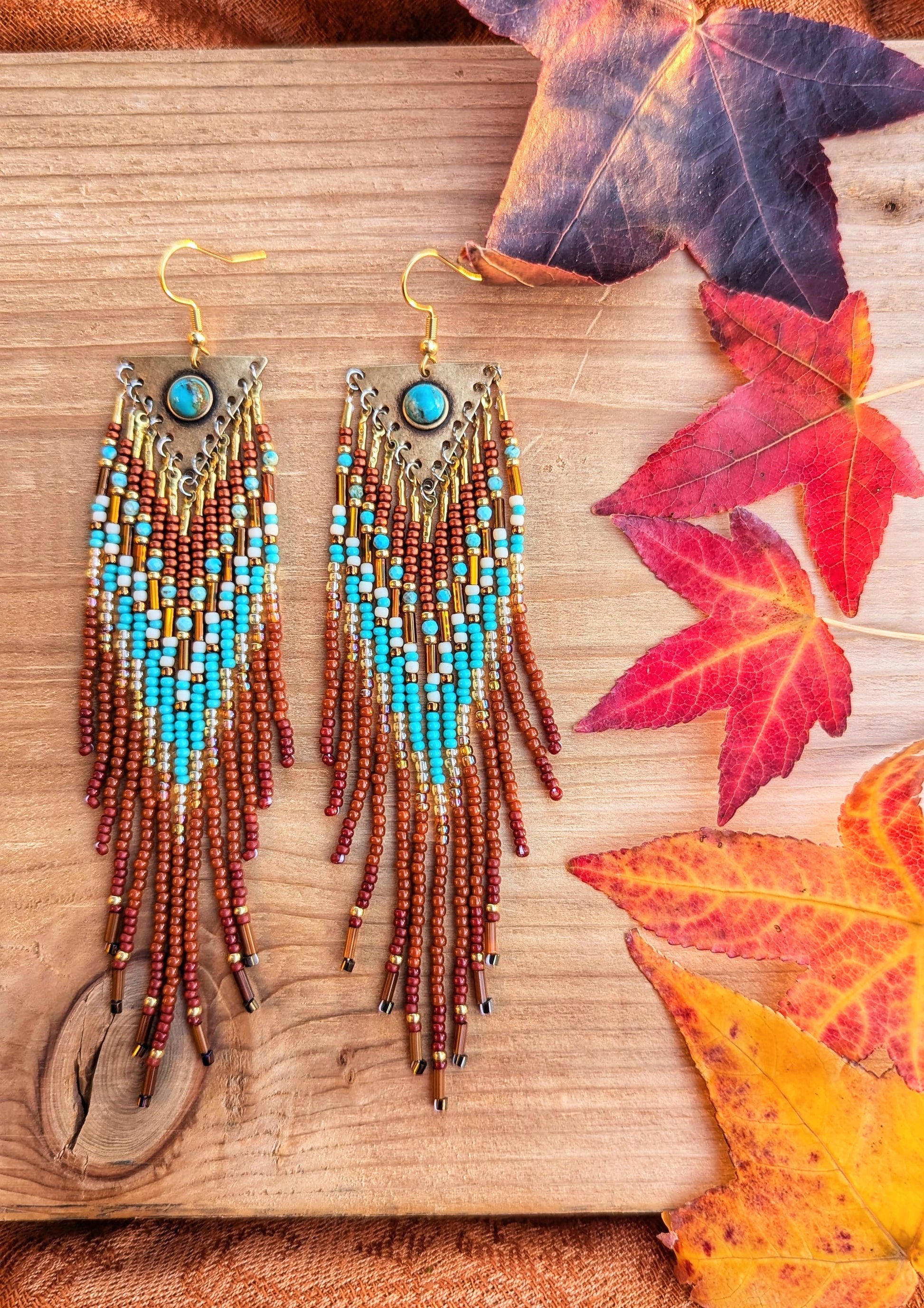Handcrafted beaded earrings by Moon & Milk featuring turquoise accents, seed beads, and brass, with a Southwestern design full of vibrant color and texture.