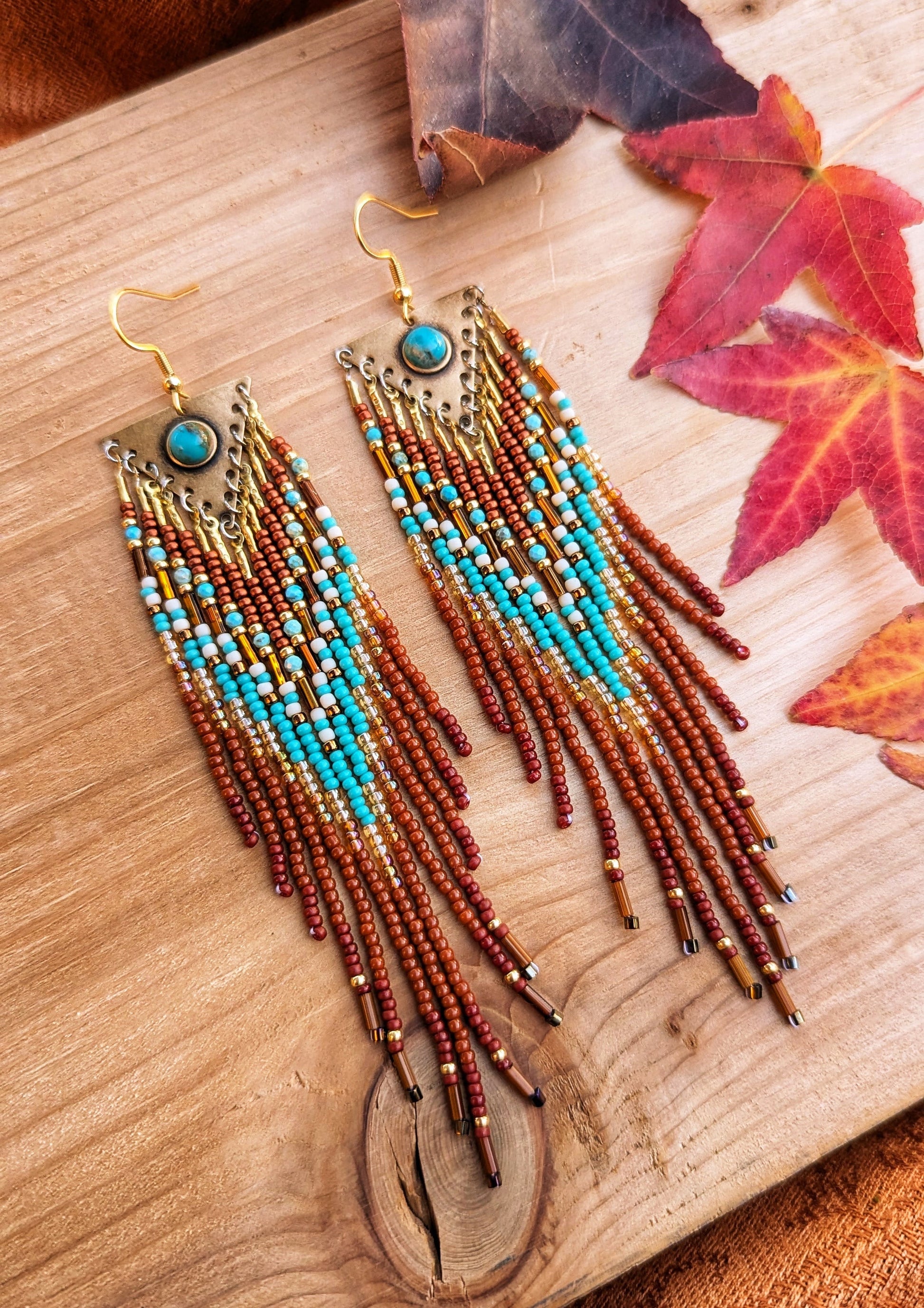 Handcrafted beaded earrings by Moon & Milk featuring turquoise accents, seed beads, and brass, with a Southwestern design full of vibrant color and texture.