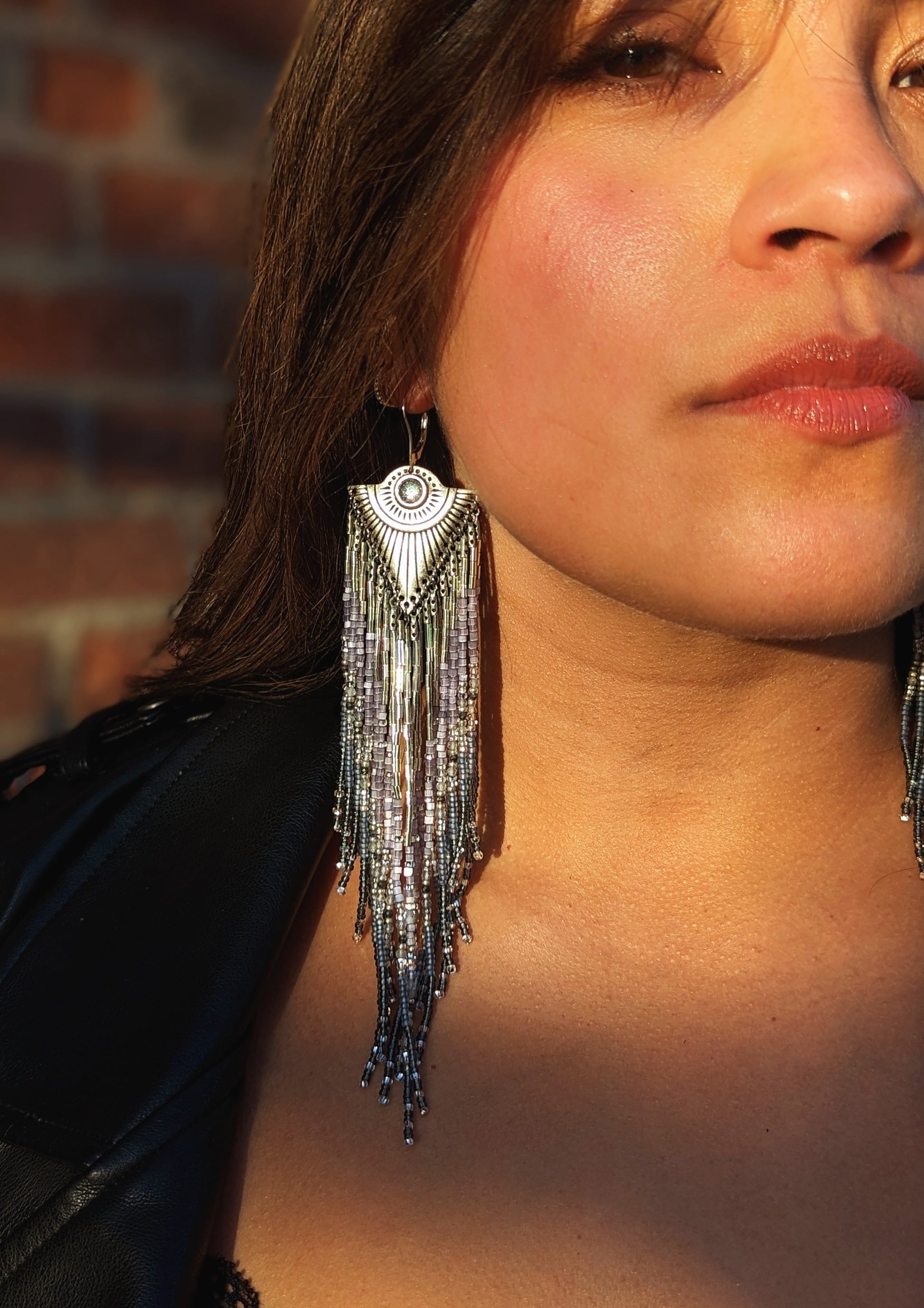 Handcrafted beaded earrings by Moon & Milk inspired by Tlaloc, featuring silver hues, labradorite, pyrite stones, topaz cabochons, and sterling silver leverbacks.