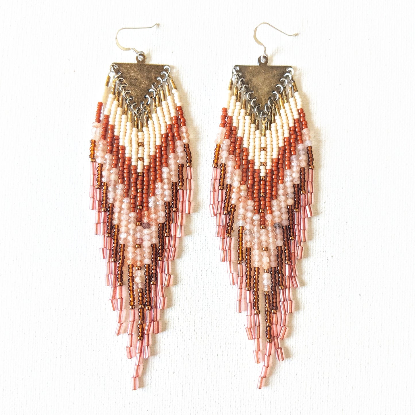 Handmade Native American style beaded earrings created with glass beads, brass, semi-precious stones, and sterling silver.