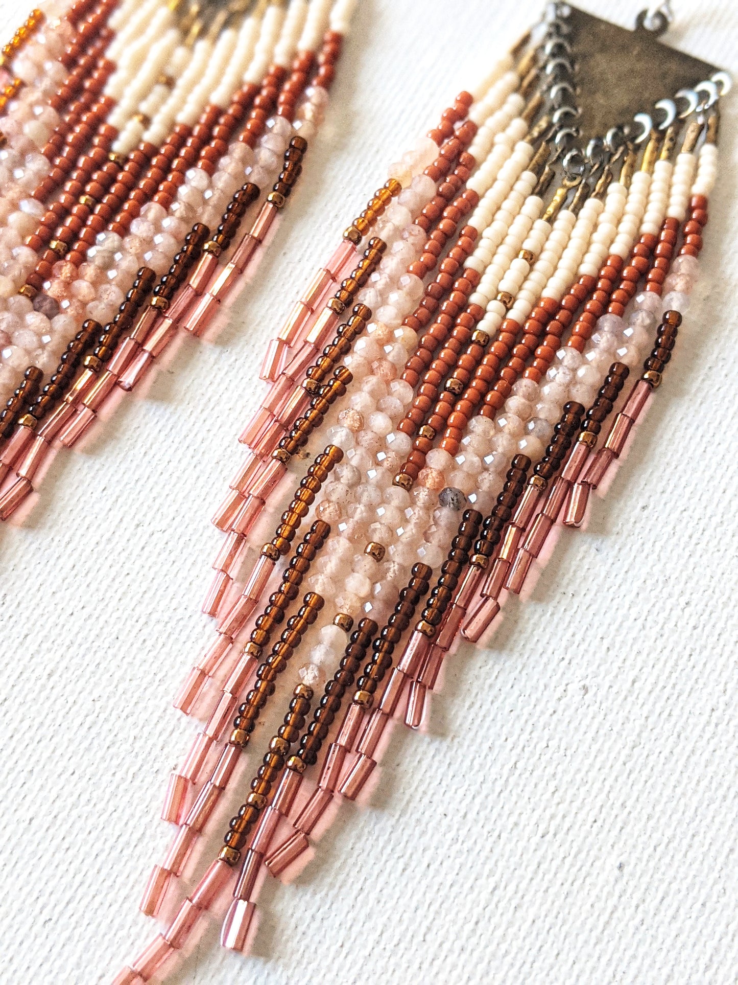 Handmade Native American style beaded earrings created with glass beads, brass, semi-precious stones, and sterling silver.