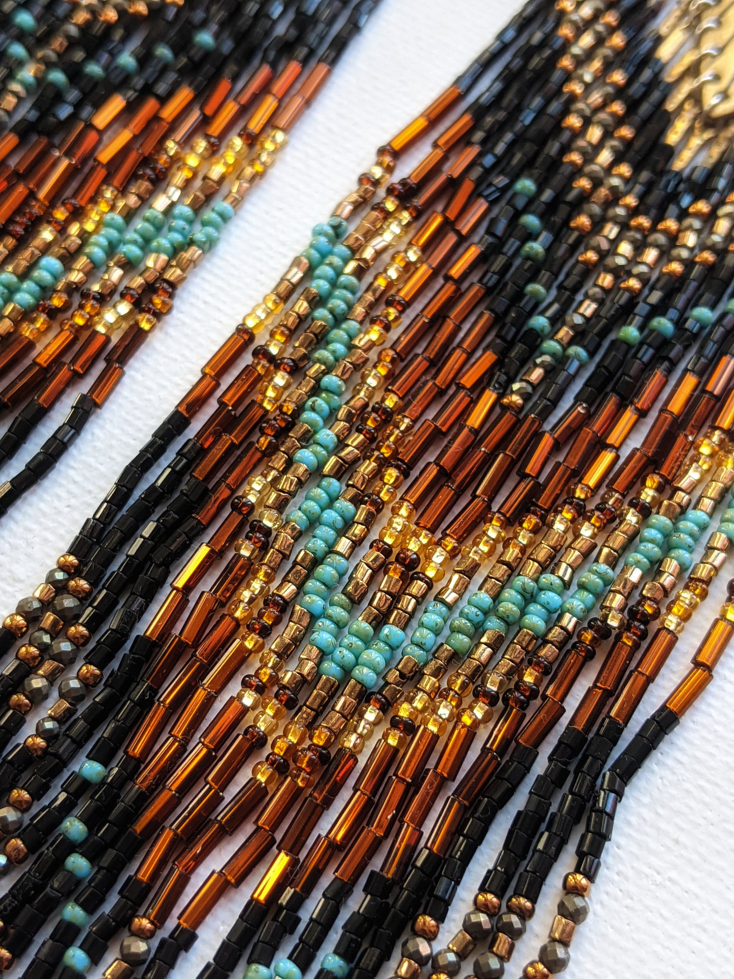 Moon & Milk - Handmade beaded tribal earrings created with semi-precious stones such as turquoise and pyrite, glass seed beads, and gold-filled ear wires.