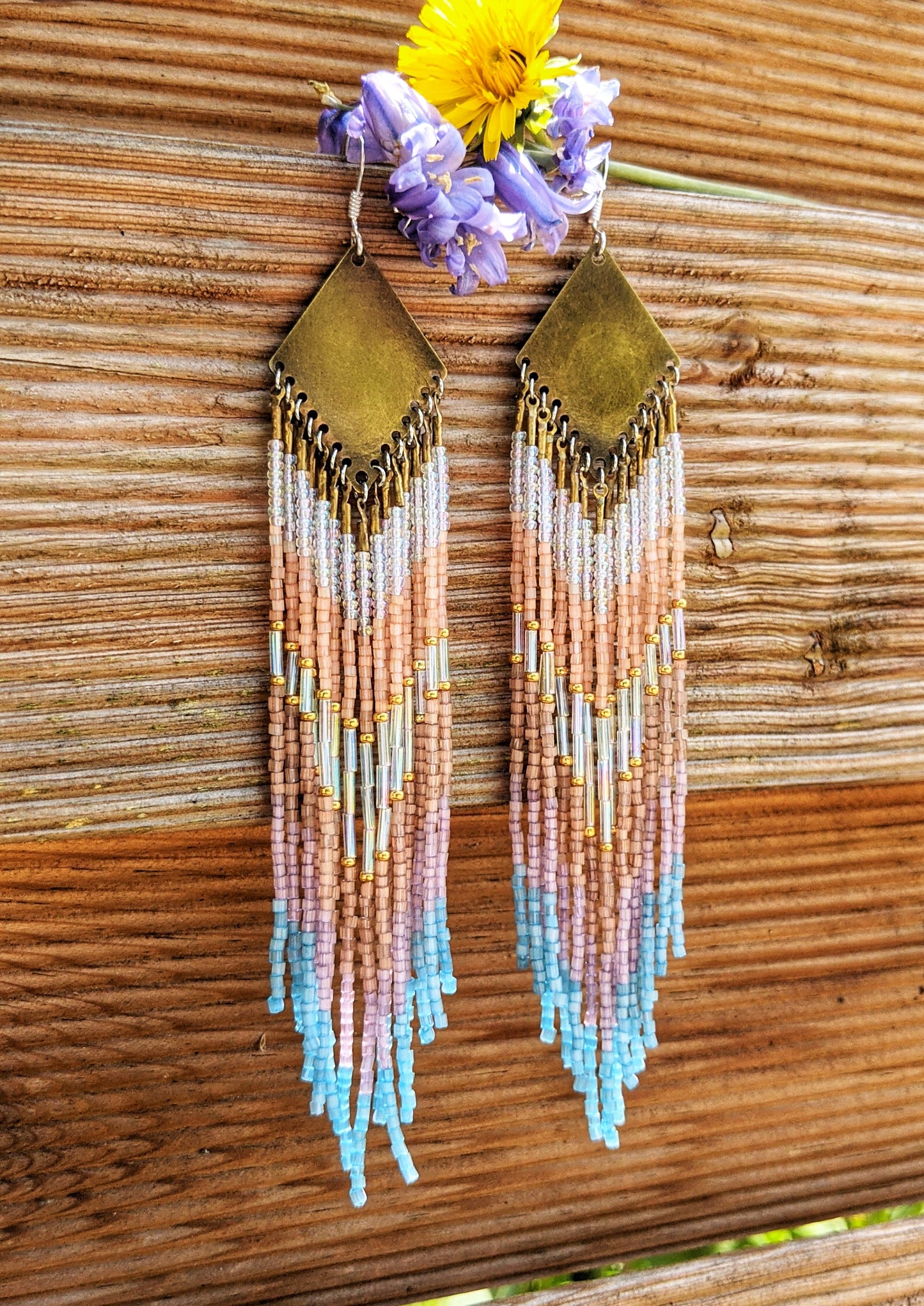 Moon & Milk artisan earrings handcrafted with satin hex-cut beads, brass, and sterling silver. Soft pastel beadwork in a long native earring design.