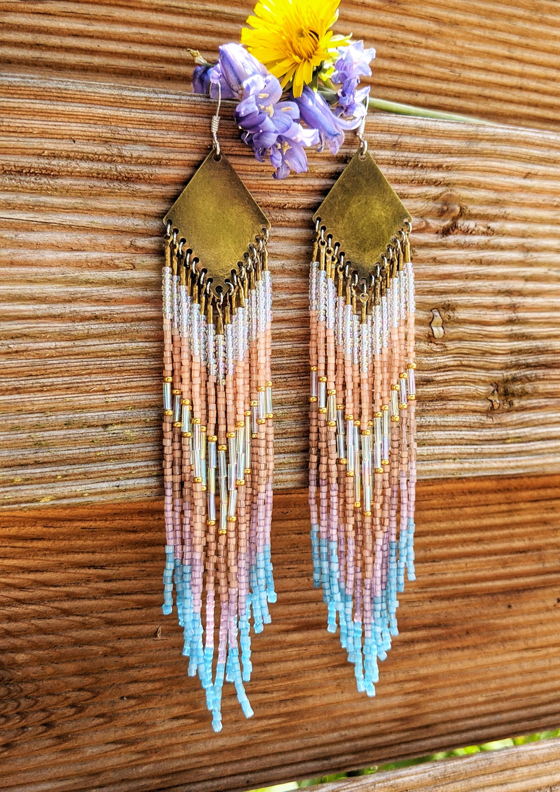 Moon & Milk artisan earrings handcrafted with satin hex-cut beads, brass, and sterling silver. Soft pastel beadwork in a long native earring design.