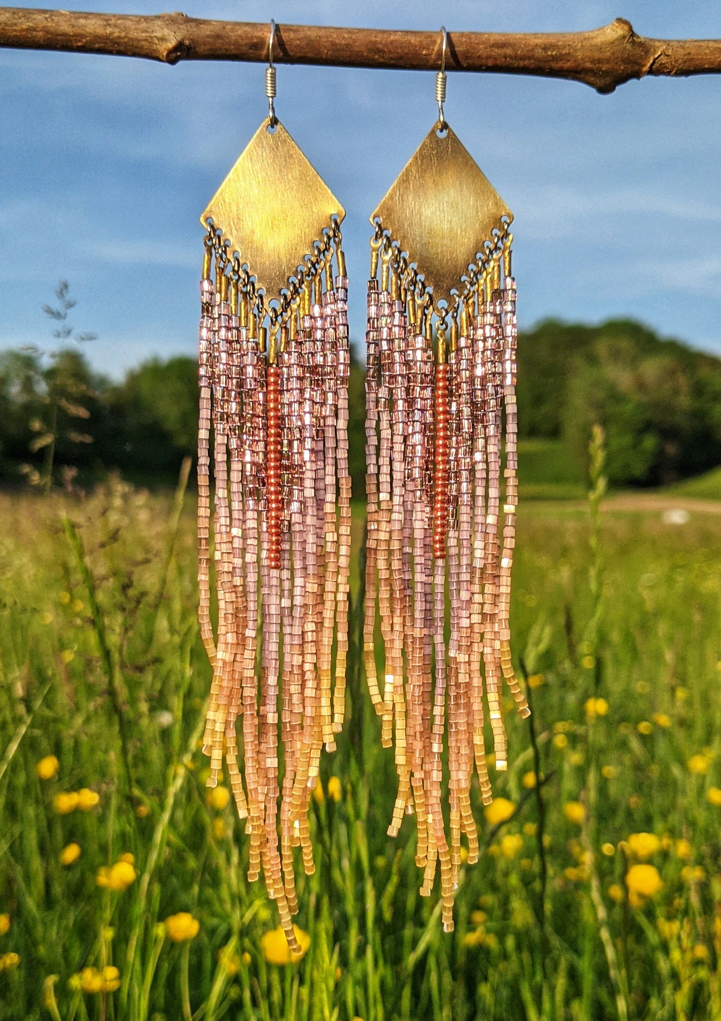 Handmade seed bead earrings with brass and sterling silver, displayed against a natural background by Moon & Milk.