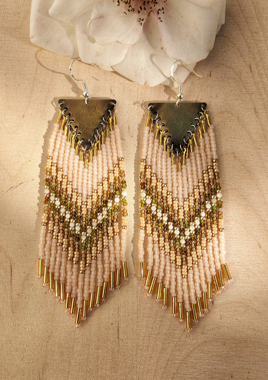 Moon & Milk handmade beaded earrings with cream, gold, olive, Mother of Pearl, and white beadwork in a chevron pattern, finished with brass findings and soft pink tips.