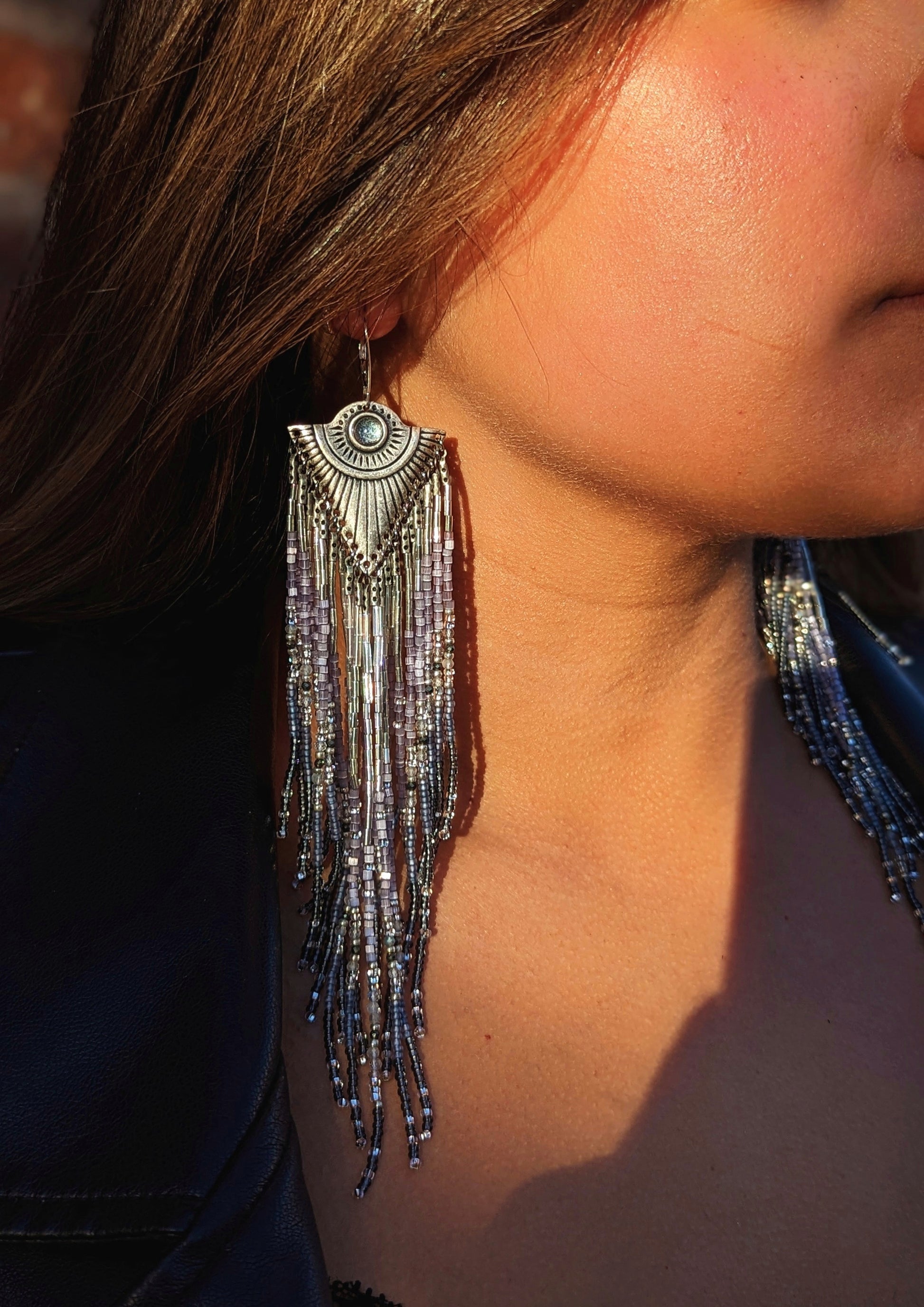 Handcrafted beaded earrings by Moon & Milk inspired by Tlaloc, featuring silver hues, labradorite, pyrite stones, topaz cabochons, and sterling silver leverbacks.