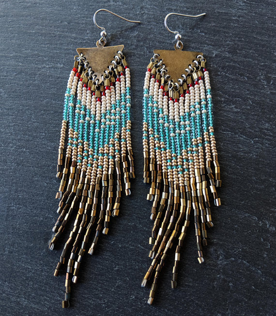 Moon & Milk - Handcrafted long native beaded earrings with 5 different layers of colors: red, pearl white, aqua, gold, and iris bronze. Created with glass beads, antique brass, and sterling silver
