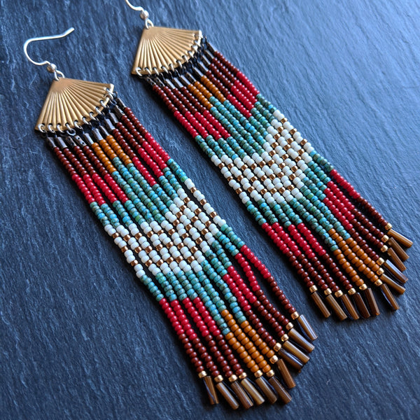 Bohemian native beaded earrings with a colorful eagle design made with Czech glass beads, sterling silver, brass, and nylon thread perfect for your boho chic look.