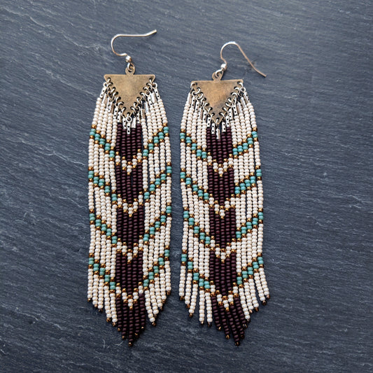 Long boho seed bead earrings with a chocolate brown and blue chevron design perfect for your bohemian wedding party.