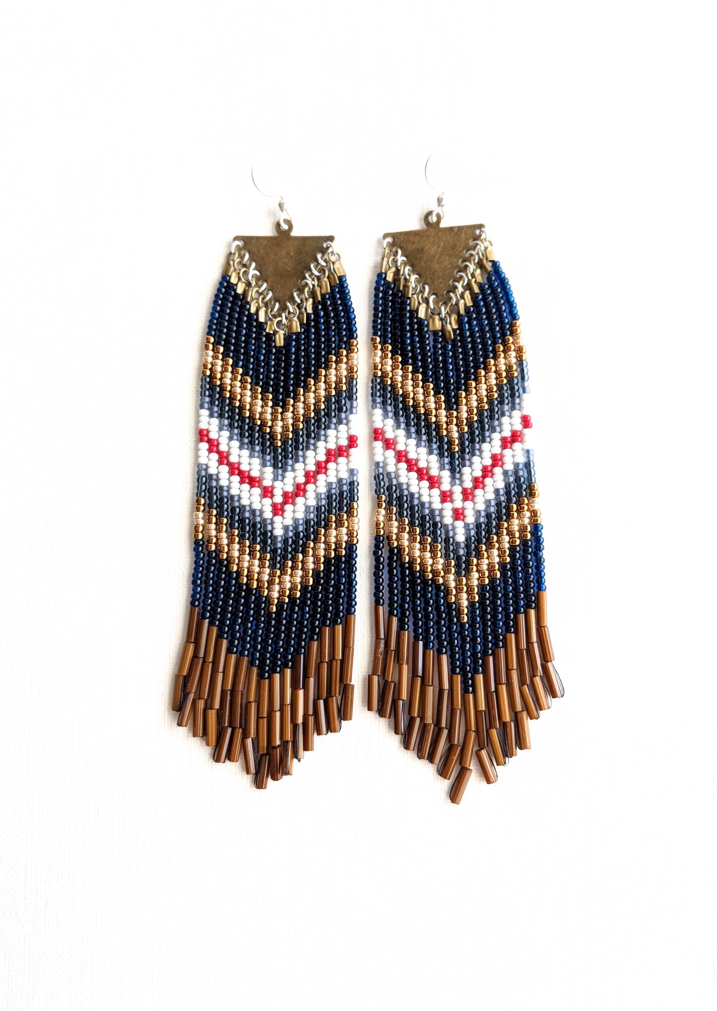 Moon & Milk - Native American style fringe earrings with a red, white, and blue chevron design. 