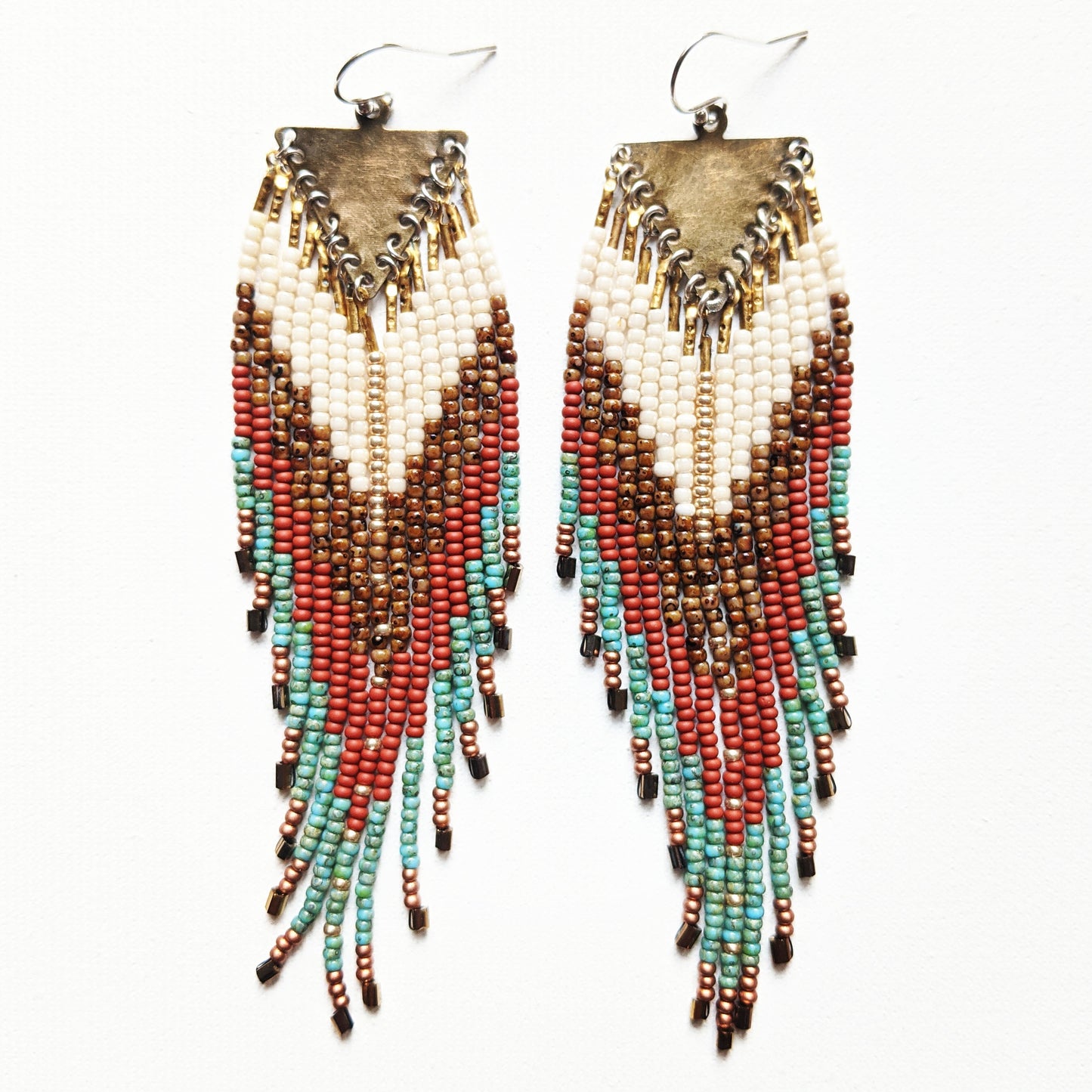Native American inspired beaded earrings with a terracotta, turquoise, gold, and Picasso brown palette, handmade with glass beads, brass, and sterling silver.