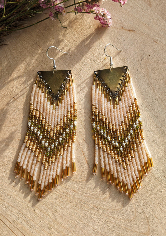 Moon & Milk handmade beaded earrings with cream, gold, olive, Mother of Pearl, and white beadwork in a chevron pattern, finished with brass findings and soft pink tips.