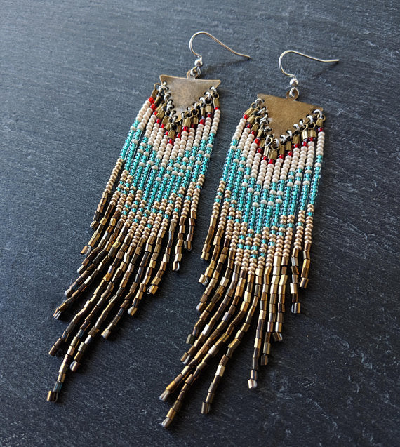 Moon & Milk - Handcrafted long native beaded earrings with 5 different layers of colors: red, pearl white, aqua, gold, and iris bronze. Created with glass beads, antique brass, and sterling silver