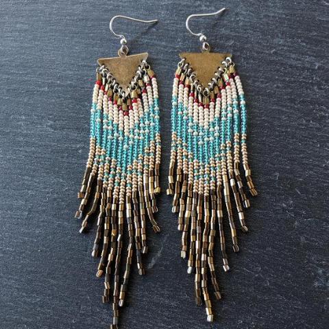 Moon & Milk - Handcrafted long native beaded earrings with 5 different layers of colors: red, pearl white, aqua, gold, and iris bronze. Created with glass beads, antique brass, and sterling silver