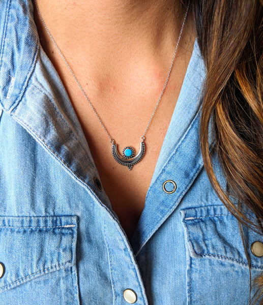 Moon & Milk - A crescent moon pendant necklace with a natural turquoise stone bezel setting and a silver c